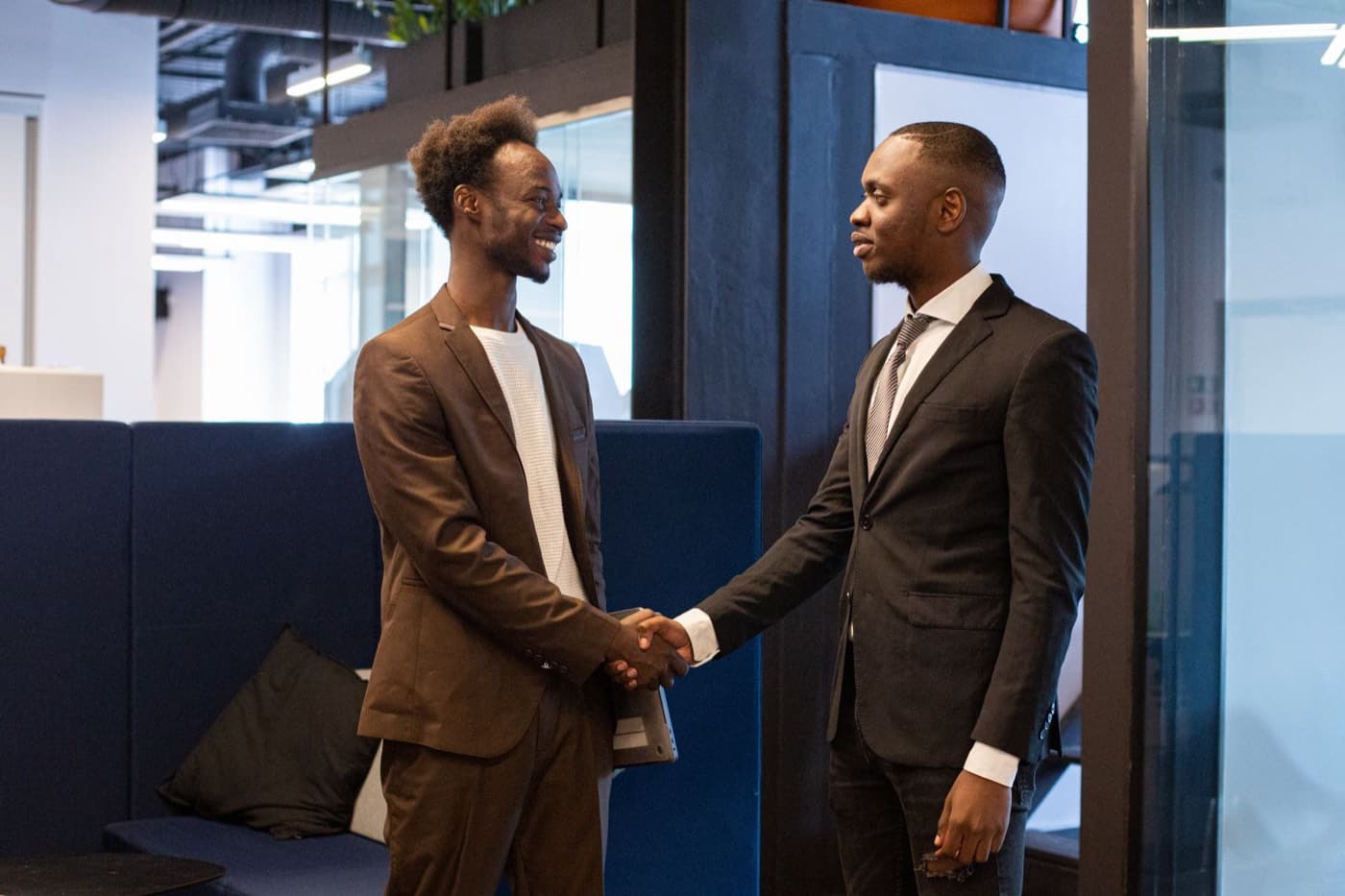 Employee handing a manager a one-page business case for certification funding